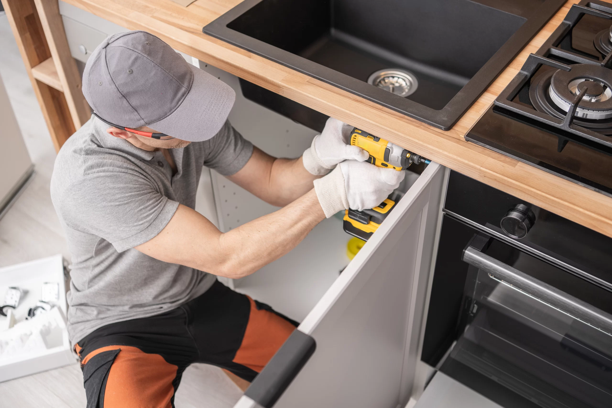 Garrels Company technician installing a kitchen sink